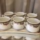 Suite de 6 pots à créme avec leur plateau en porcelaine de limoges