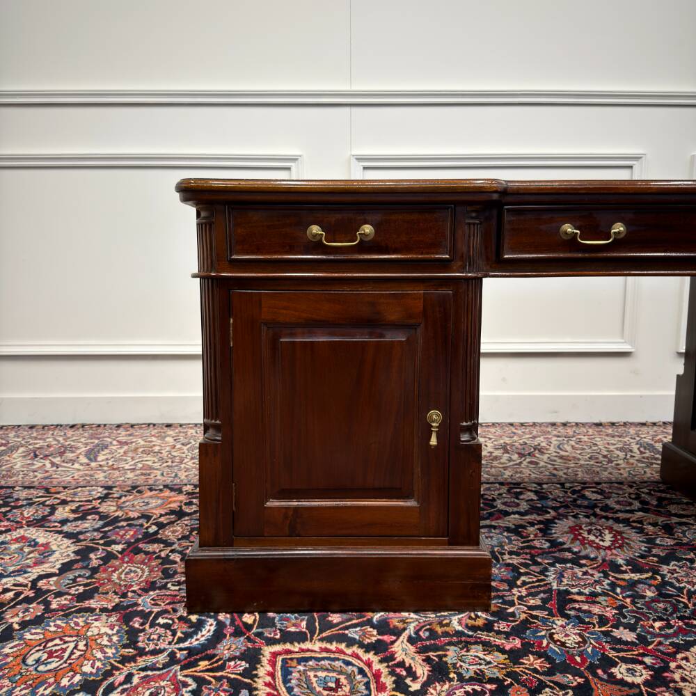 Classic English desk with green leather inlay.