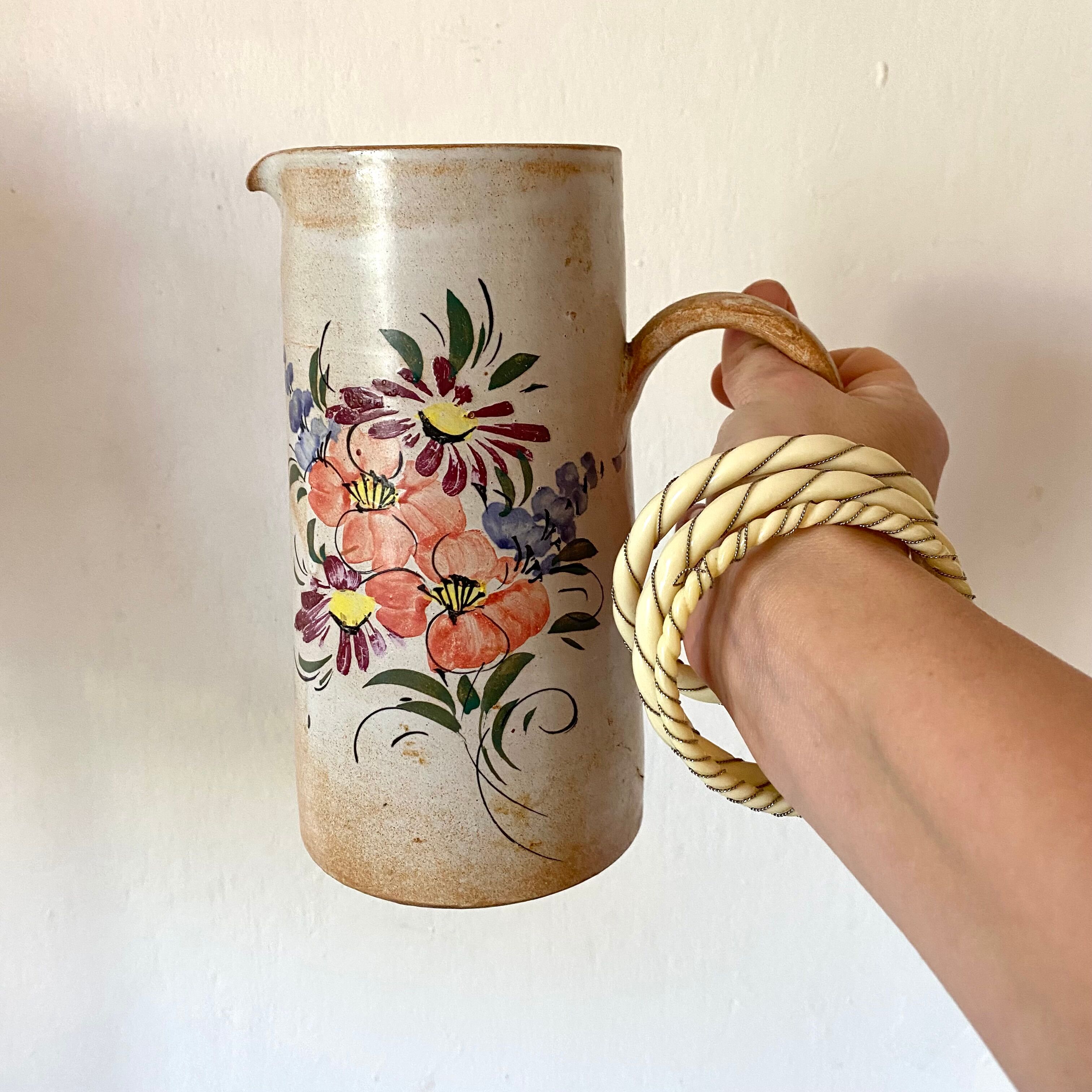 Stoneware pitcher with floral decoration