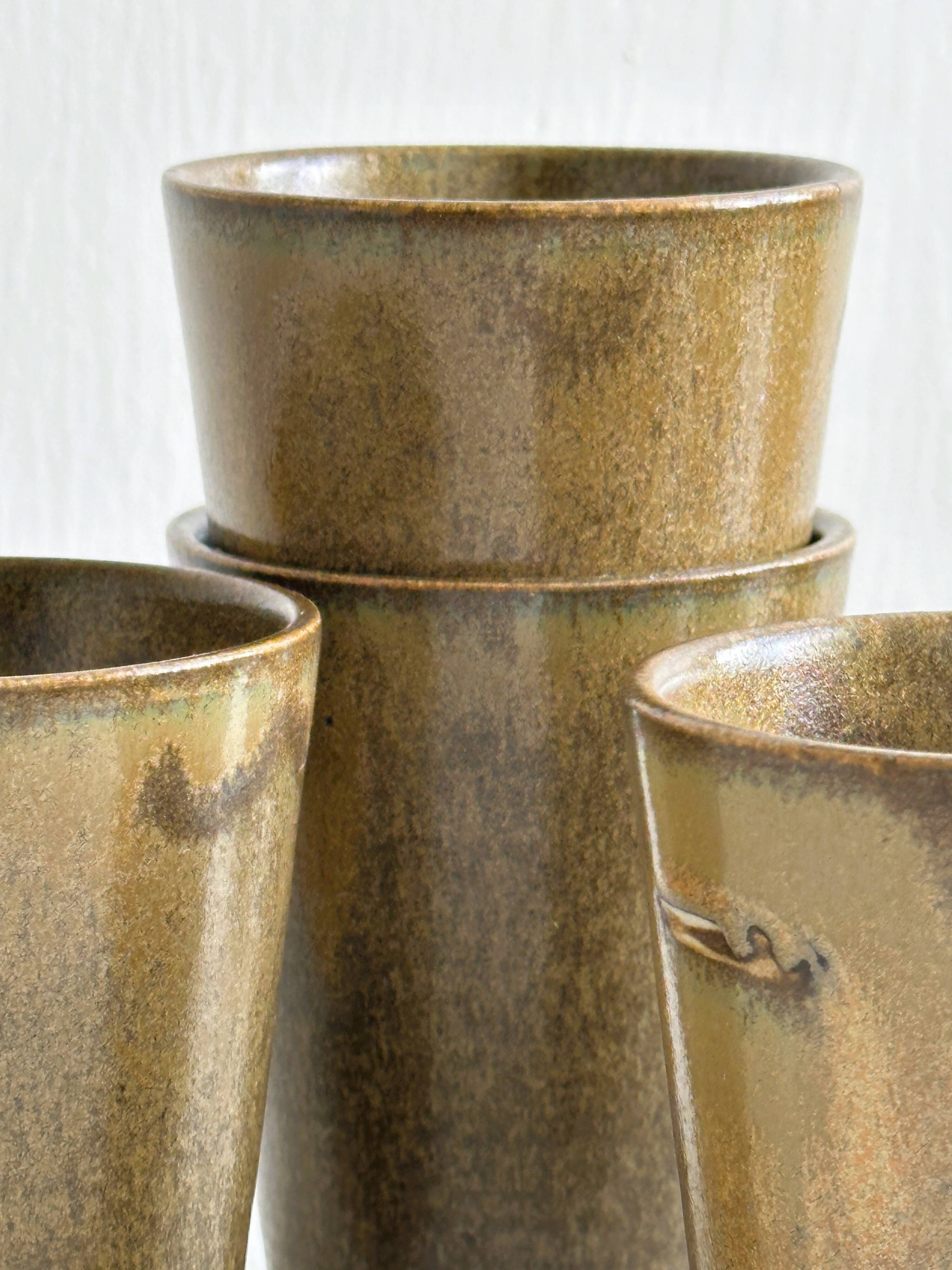 6 Digoin ceramic mugs.