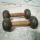 Pair of vintage dumbbells in cast iron and wood
