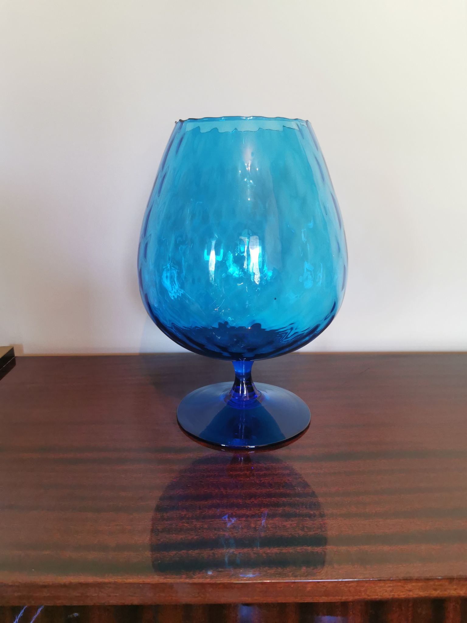 Vintage vase in light blue glass.