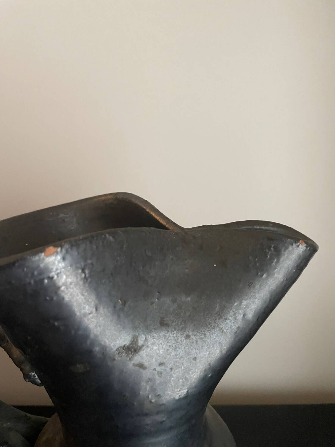 Black ceramic pitcher by Jean Marais