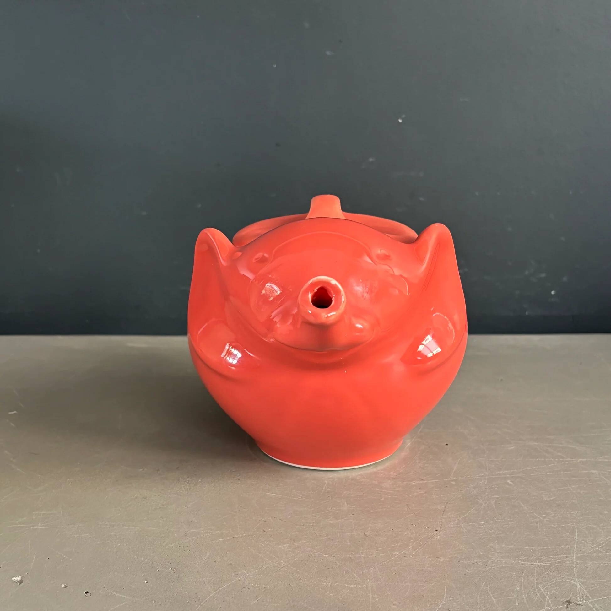 Large coral-coloured elephant teapot.