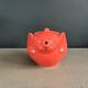 Large coral-coloured elephant teapot.
