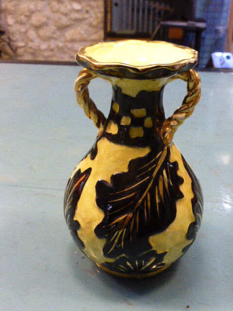 Vase amphora, stamped Vallauris, enamelled ceramic with decorations of black foliage on yellow background, vintage 1950