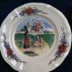 12 plates of the Obernai earthenware décor service signed Henri Loux