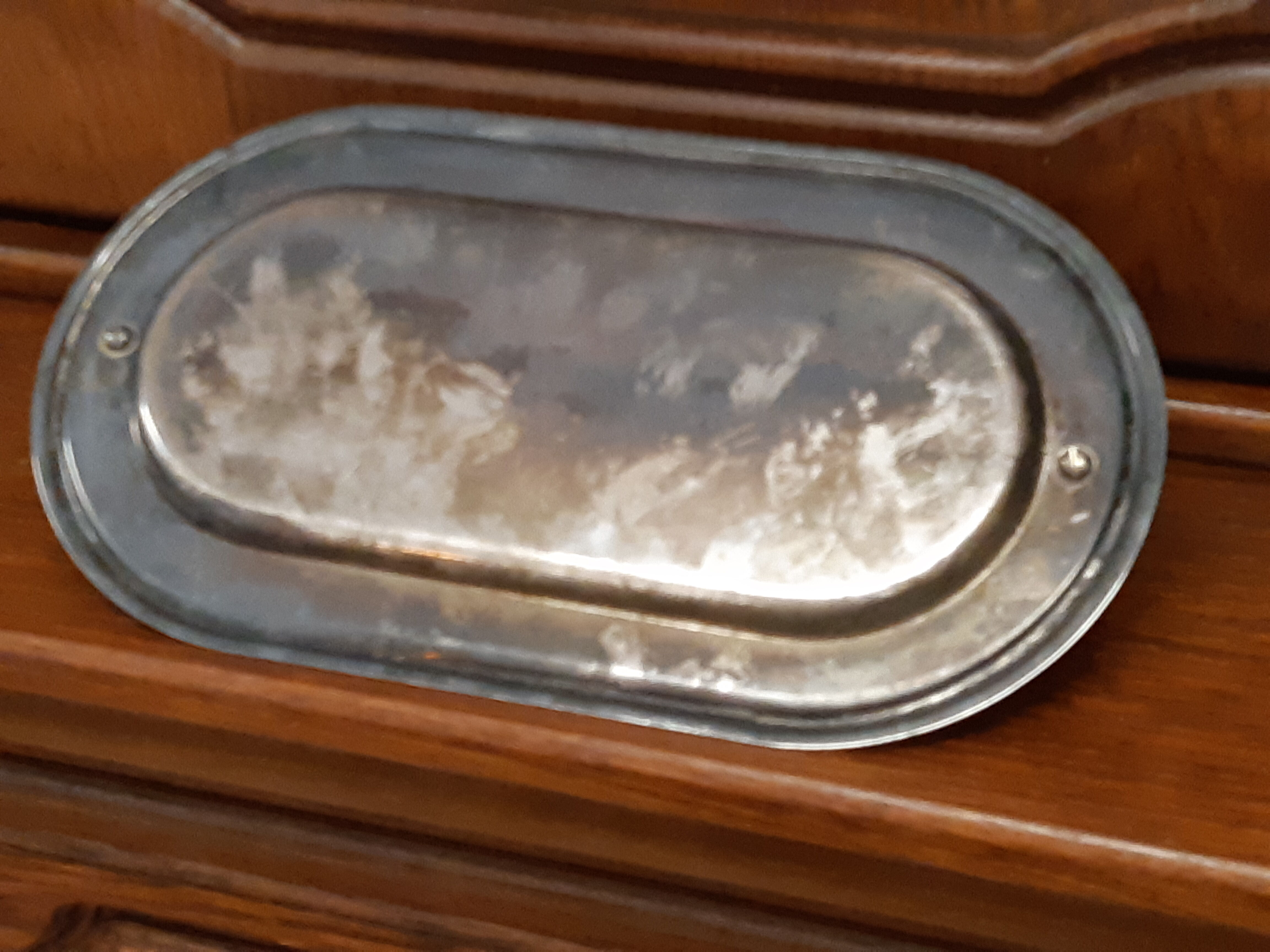 Silver dish with foie gras, duck heads