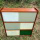 Vintage 1960s display shelf with sliding glass doors.