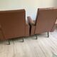 Paire de fauteuils en skai marron vintage annees 50