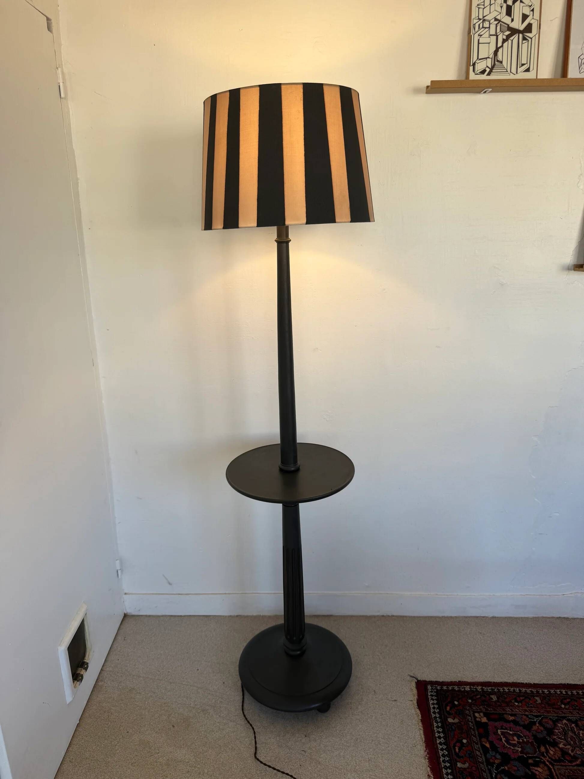 Vintage floor lamp in black patinated wood and striped lampshade