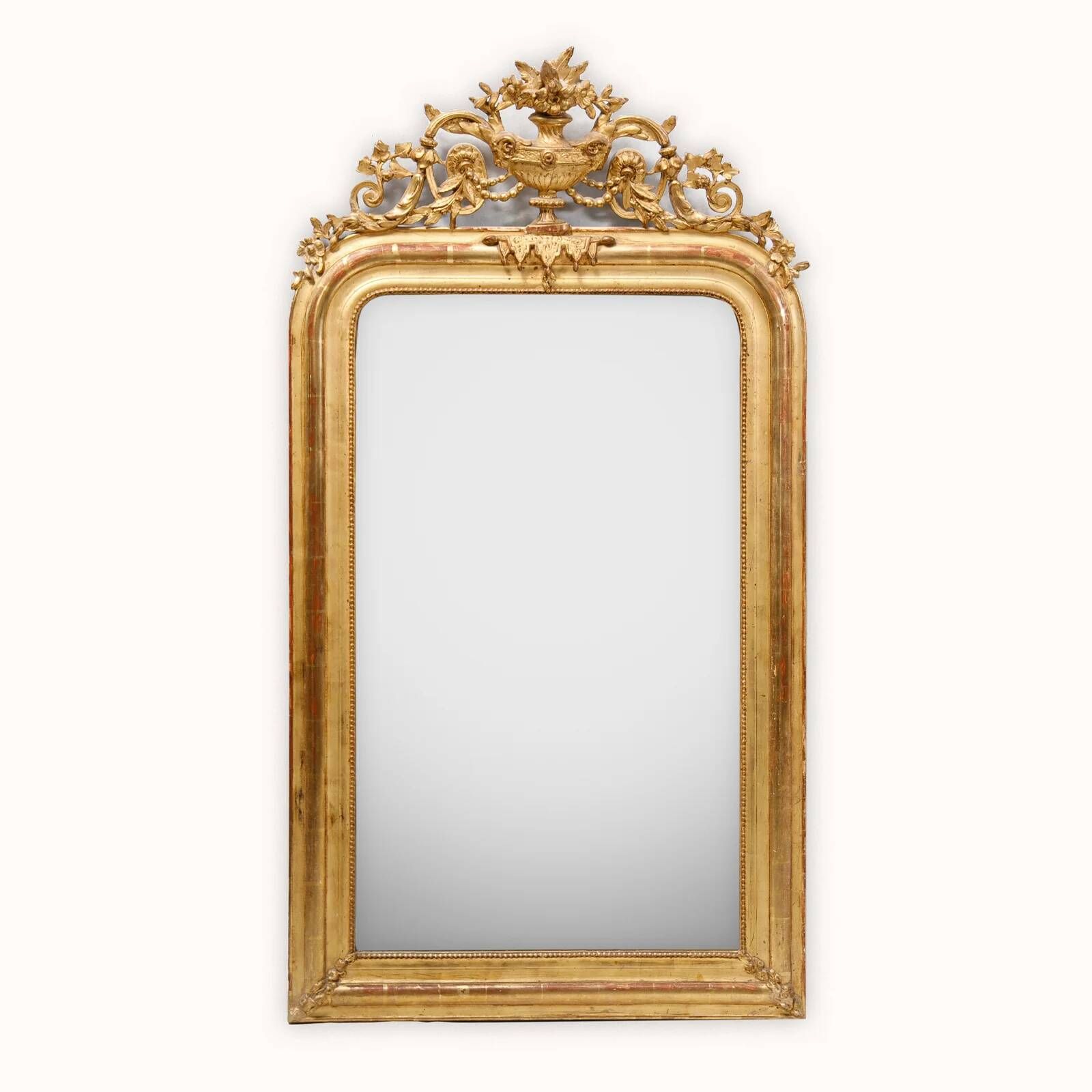 Louis-Philippe mirror from the 19th century with vase and crown of flowers.