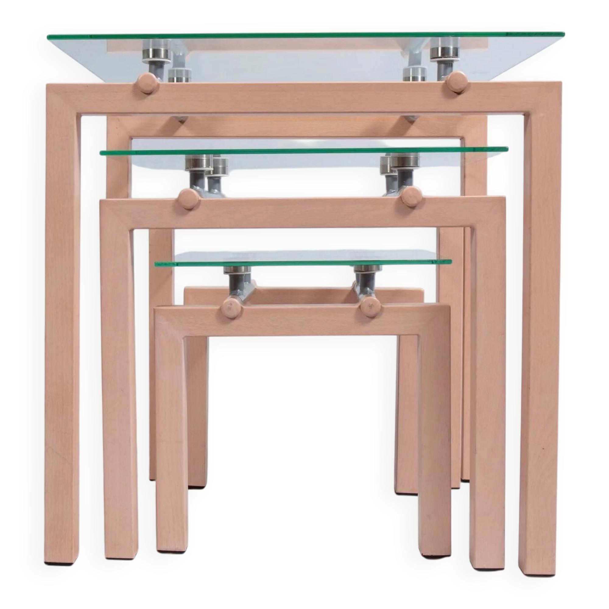 Three nesting tables from the 90s made of painted metal and tempered glass.