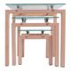 Three nesting tables from the 90s made of painted metal and tempered glass.