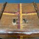 Antique brown travel case with wooden slides from the early 1900s