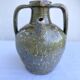 Ancient oil jar in glazed terracotta, khaki green — Auvergne, Lezou