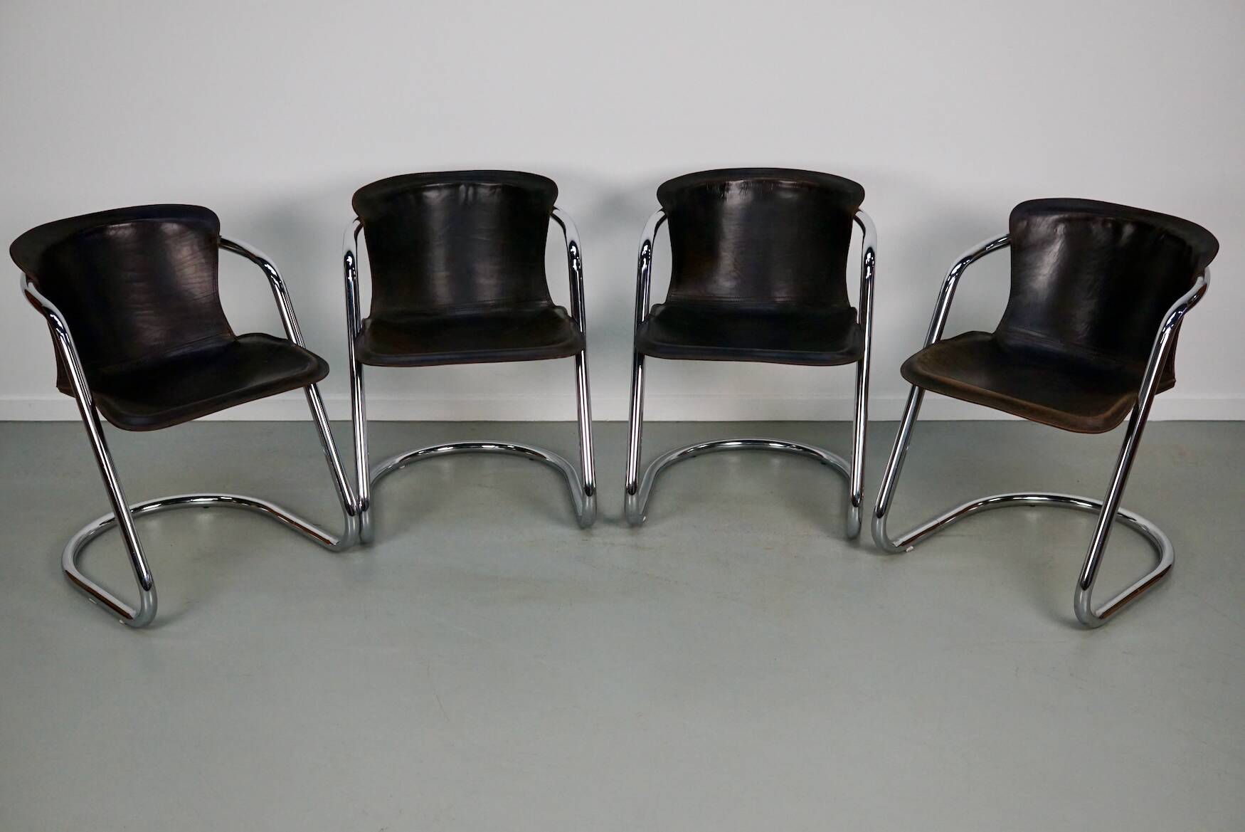 Set of four brown leather dining chairs, Willy Rizzo, 1970