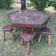 Handcrafted hexagonal wooden table with natural decor.