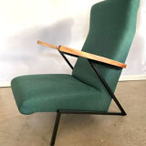 Lounge or easy chair with armrests
