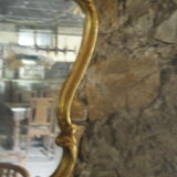 Large gilded mirror Louis XV style with shell.