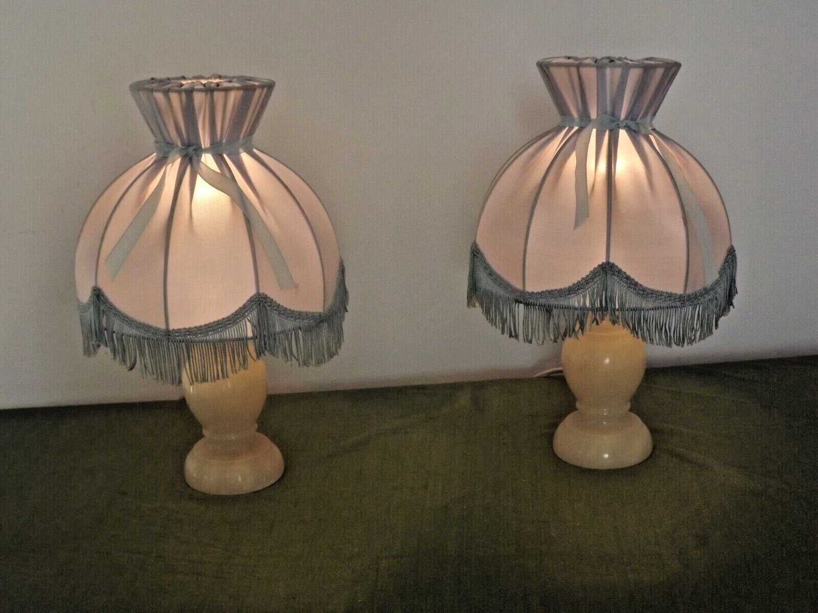 Pair of marble bedside lamps with blue satin fringed shades