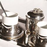 Silver-plated metal coffee service with a grape design.