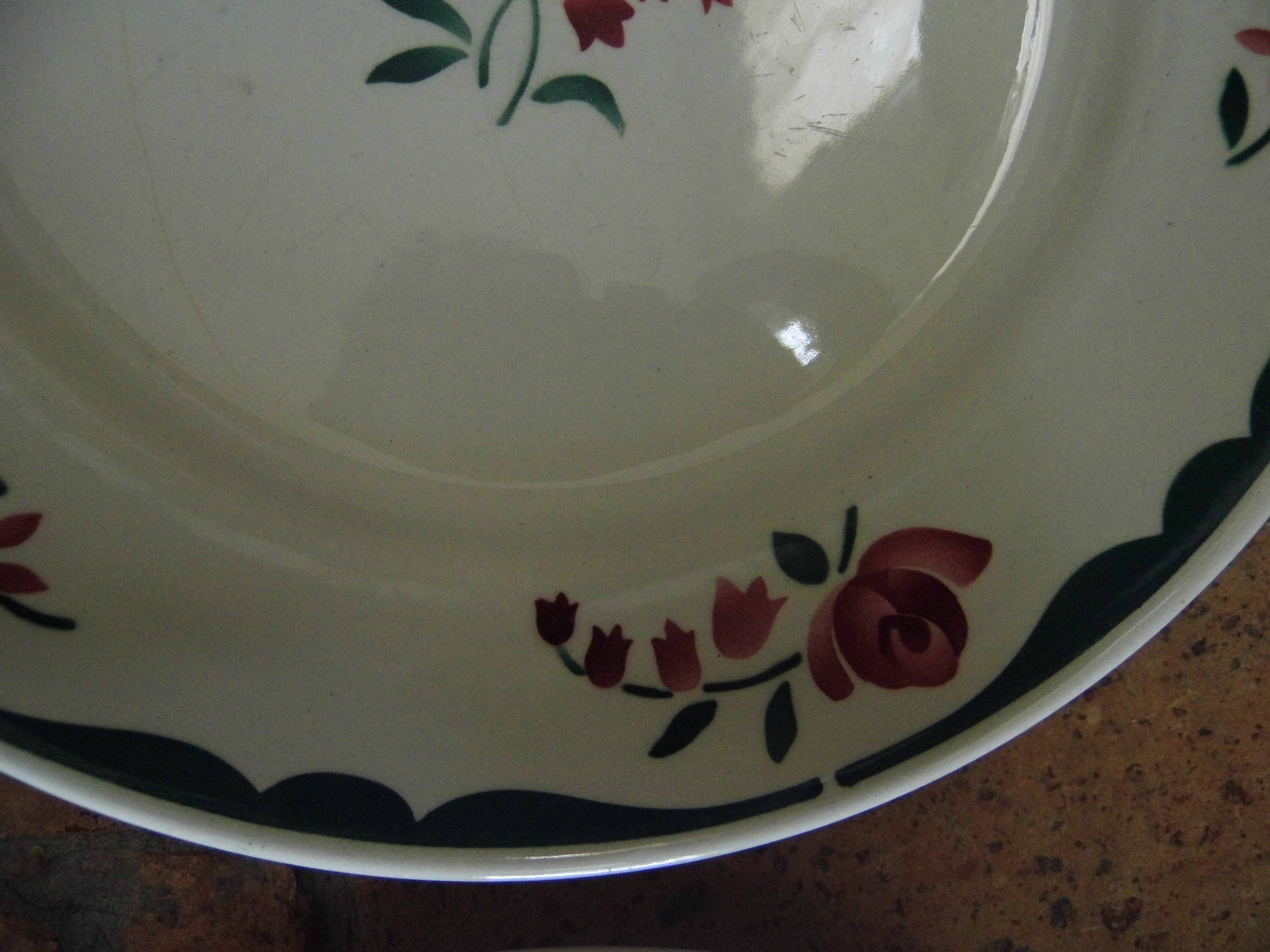 4 plates in faience of Badonviller F.B, floral motif, 20s