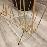Vintage magazine rack in gold metal