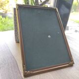Vintage photo frame in gold and decorated metal