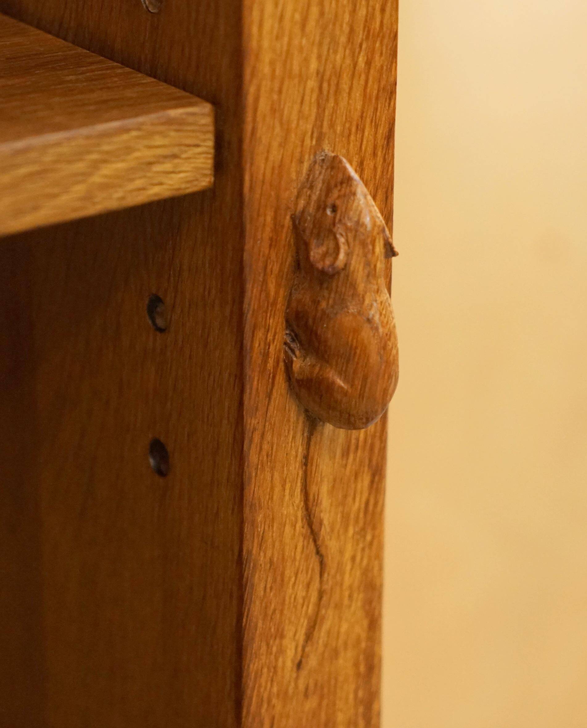 Pair of Robert Mouseman Thompson oak carved bookshelves.