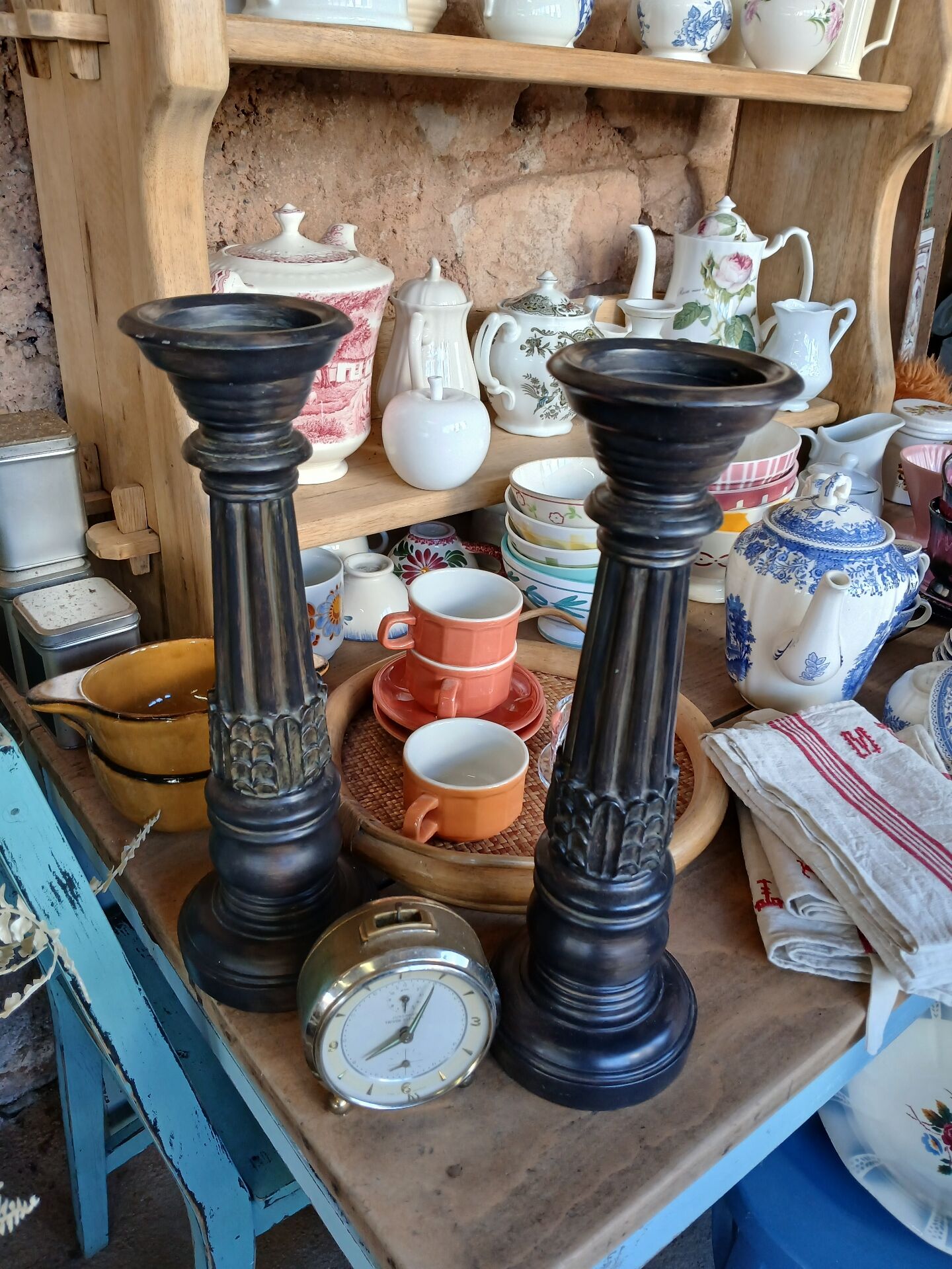 2 carved wooden candlesticks