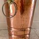 Vintage copper lion's head umbrella holder