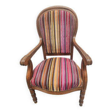 Antique striped multicoloured velvet armchair with turned legs.