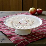 Large vintage earthenware pie dish on a pedestal, apple pie