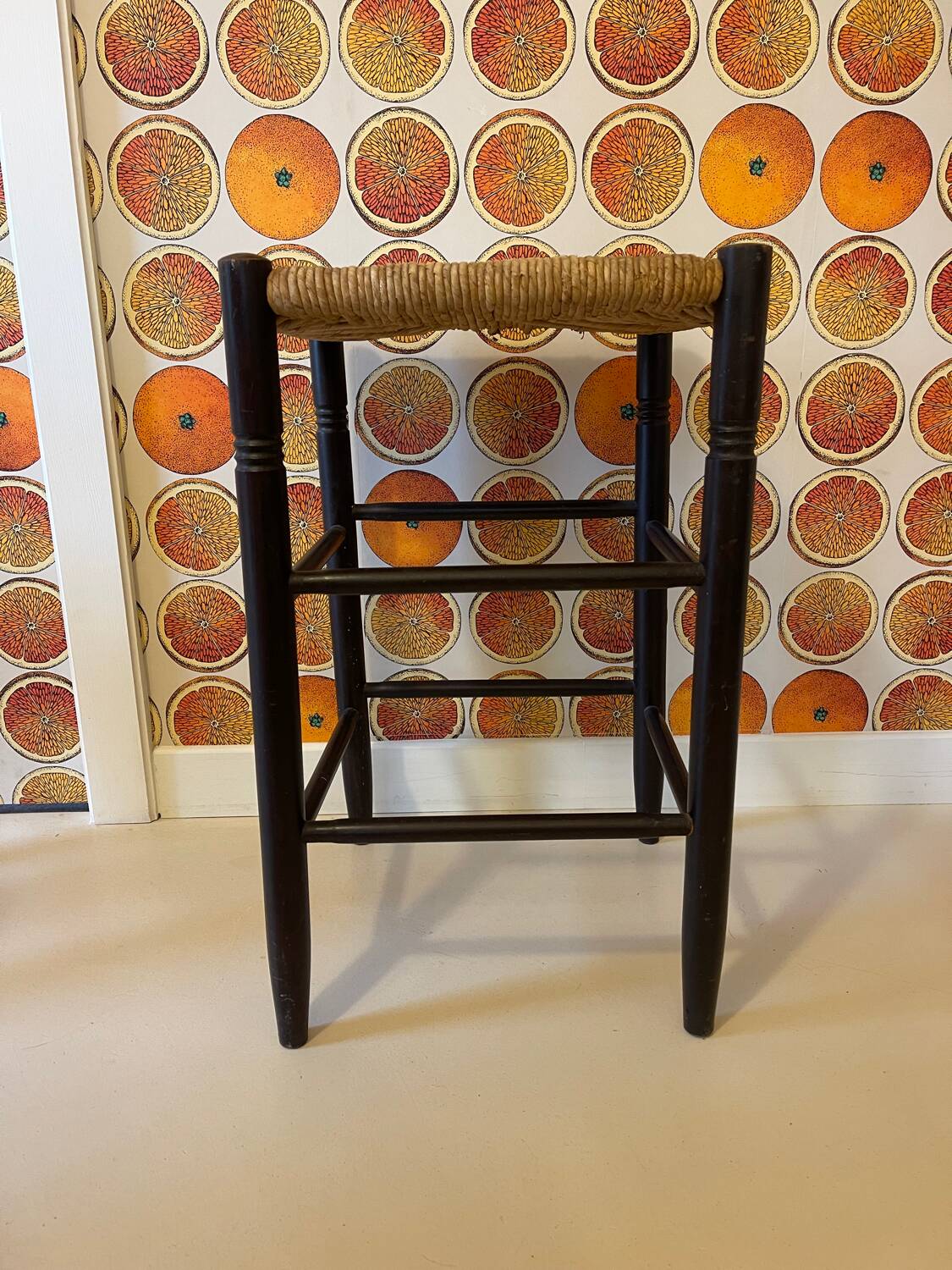 High stool made of wood and straw