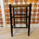 High stool made of wood and straw