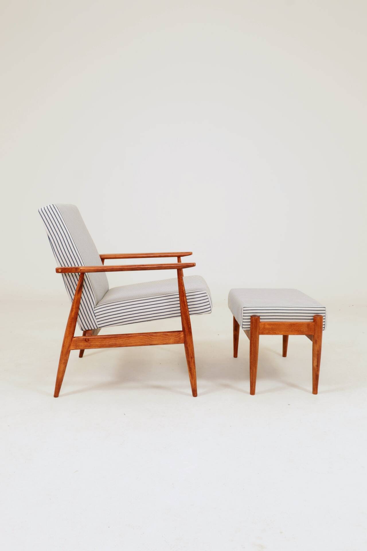 Armchair with striped fabric footrest, 1960