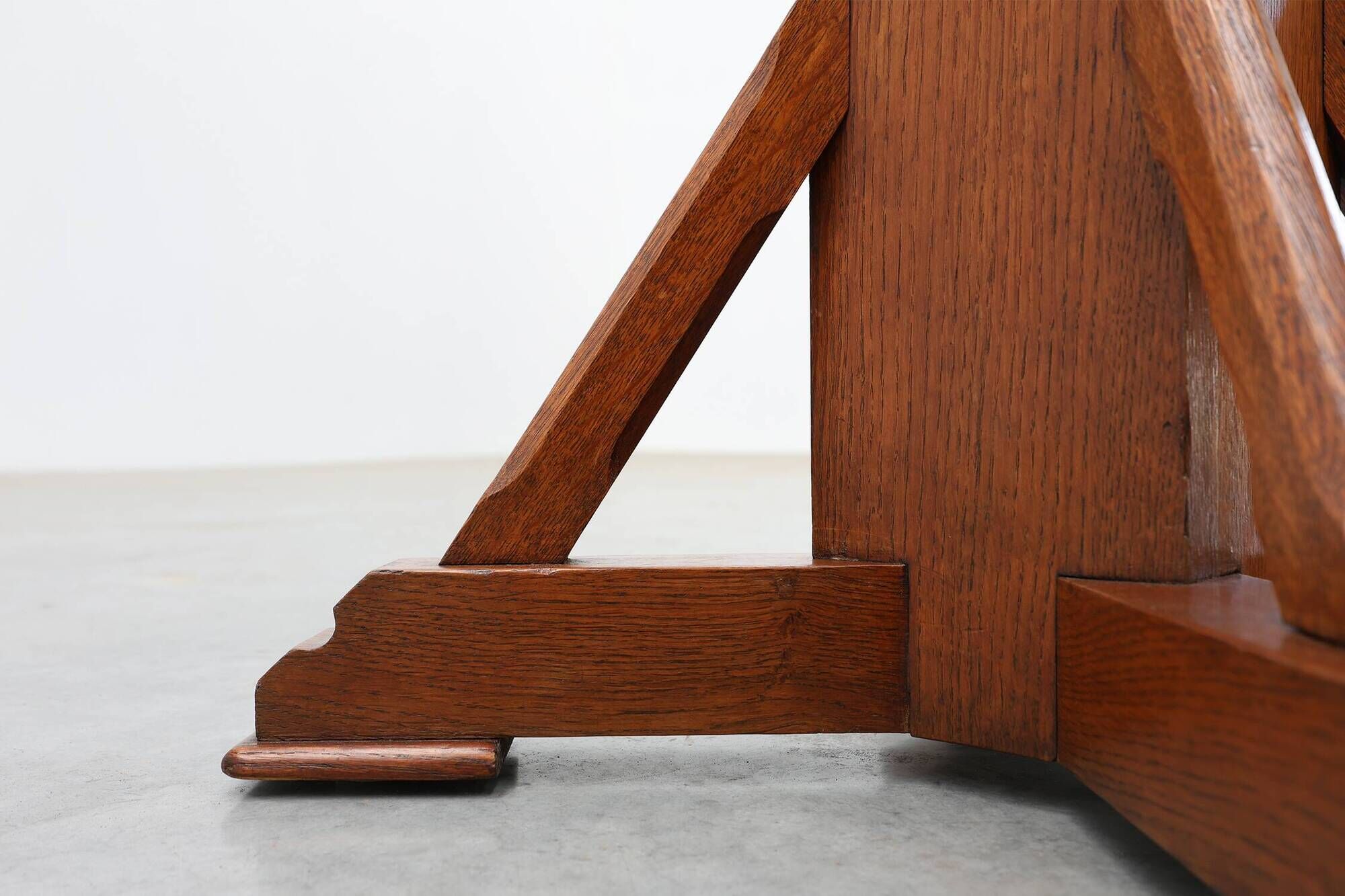 Art Deco oak pedestal with pierced brackets and cross base, Belgium 1920s