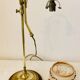 Old lamp adjustable on foot tulip golden brass.