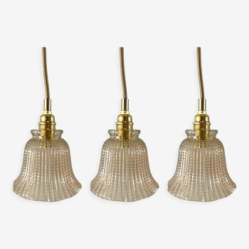 Set of three new electrified golden glass pendant lamps