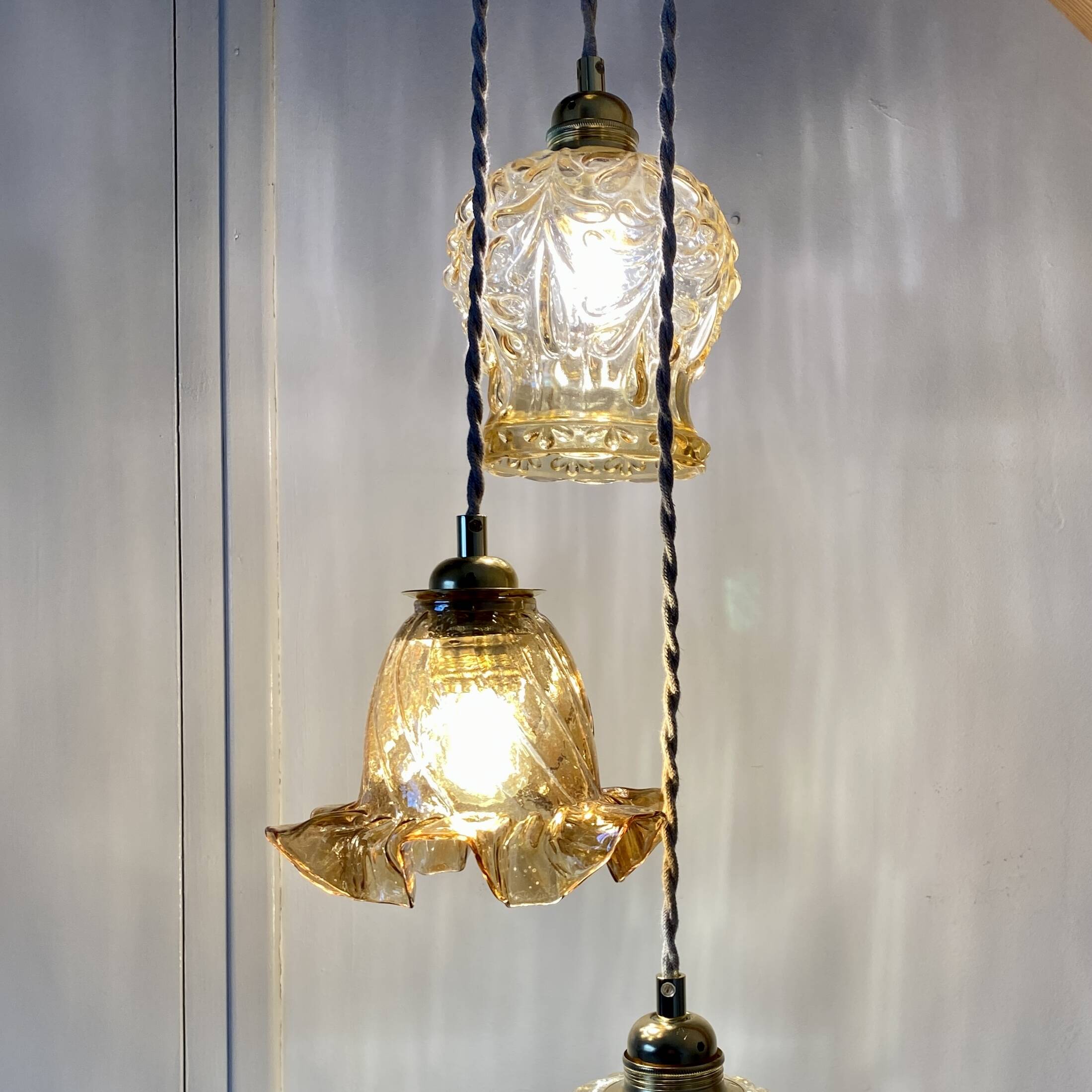 Vintage triple globe waterfall pendant light in amber glass