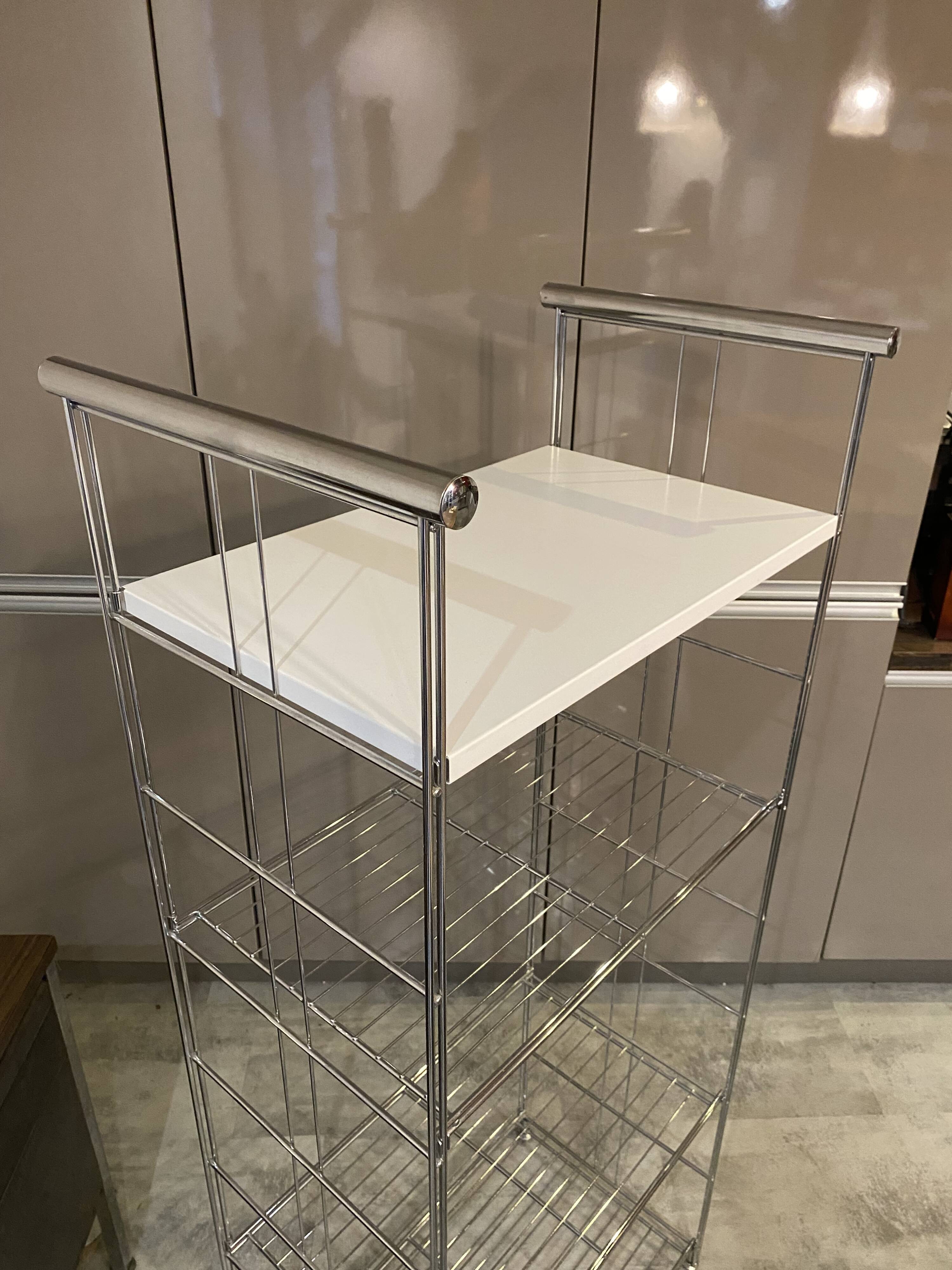 Modular wall bookshelf desk in vintage chrome.