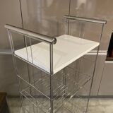 Modular wall bookshelf desk in vintage chrome.