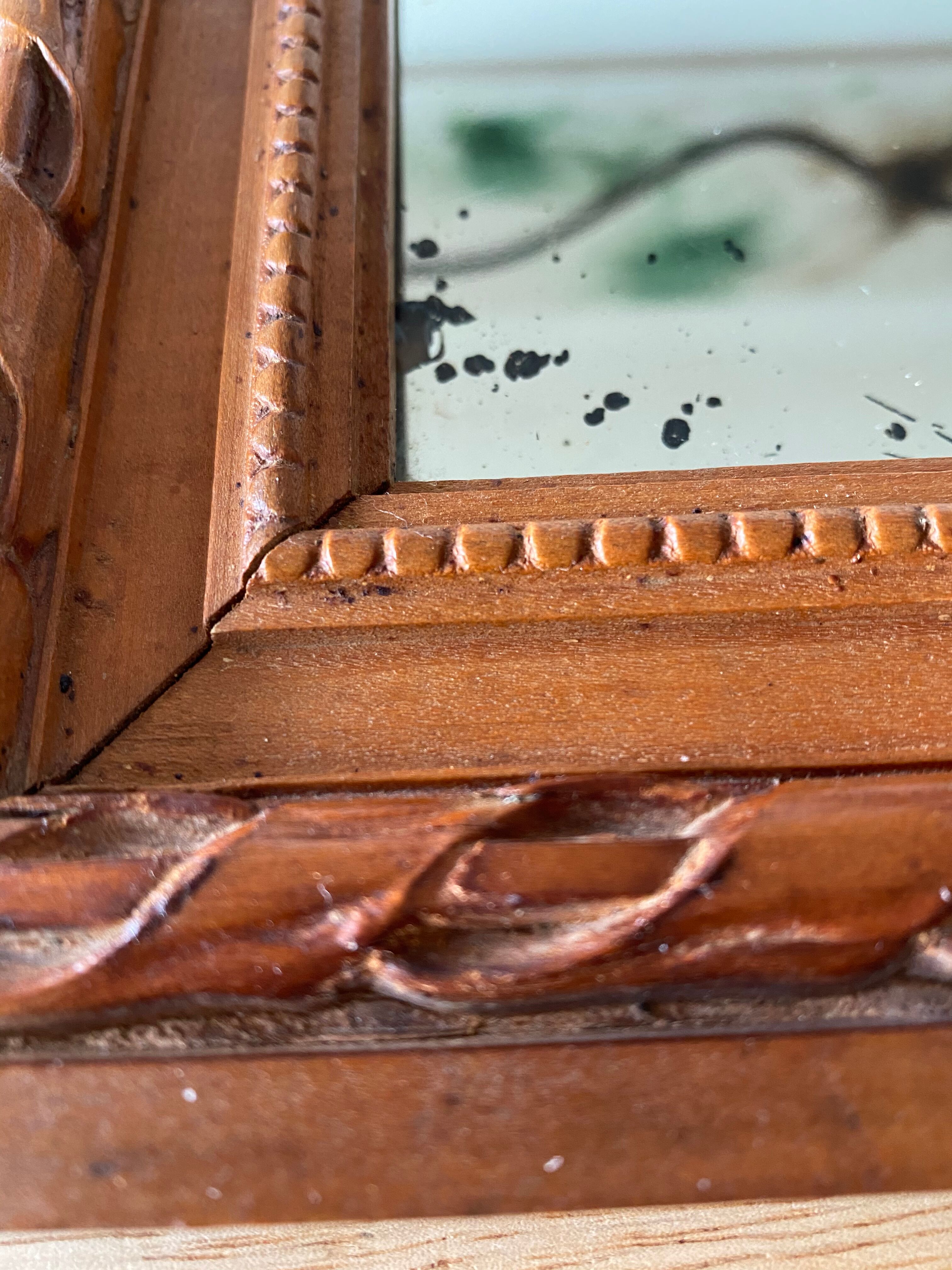 Antique mirror in carved wood and mercury 48x63cm