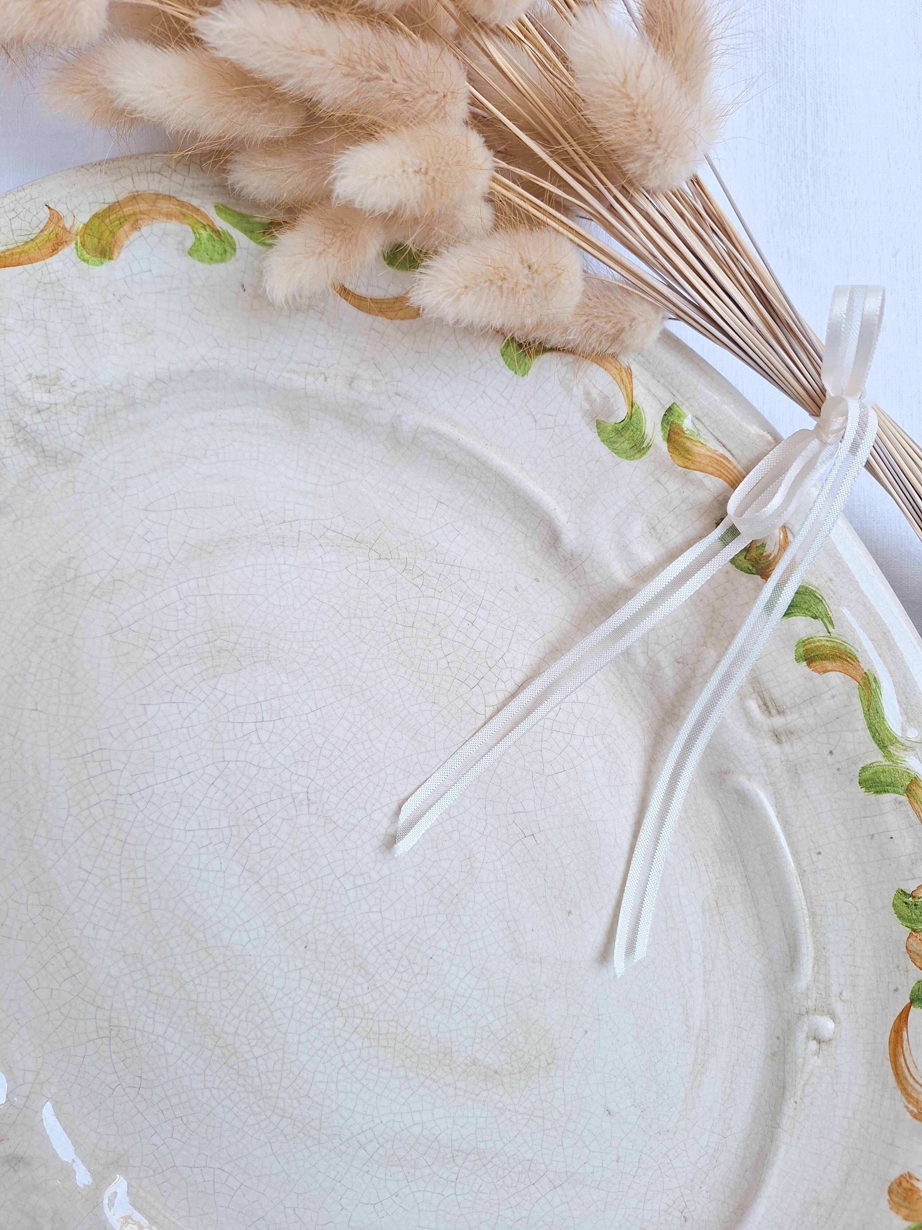 Oval plate, hand-painted meat platter in orange and green.