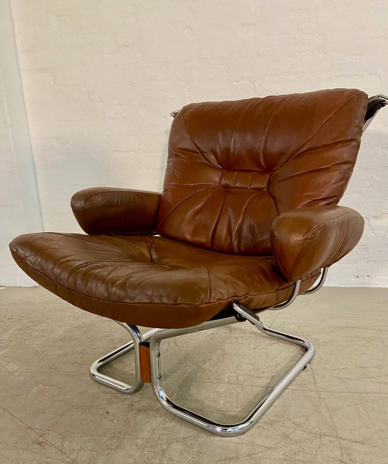 Vintage mid-century Scandinavian cognac leather lounge chair by Harald Relling