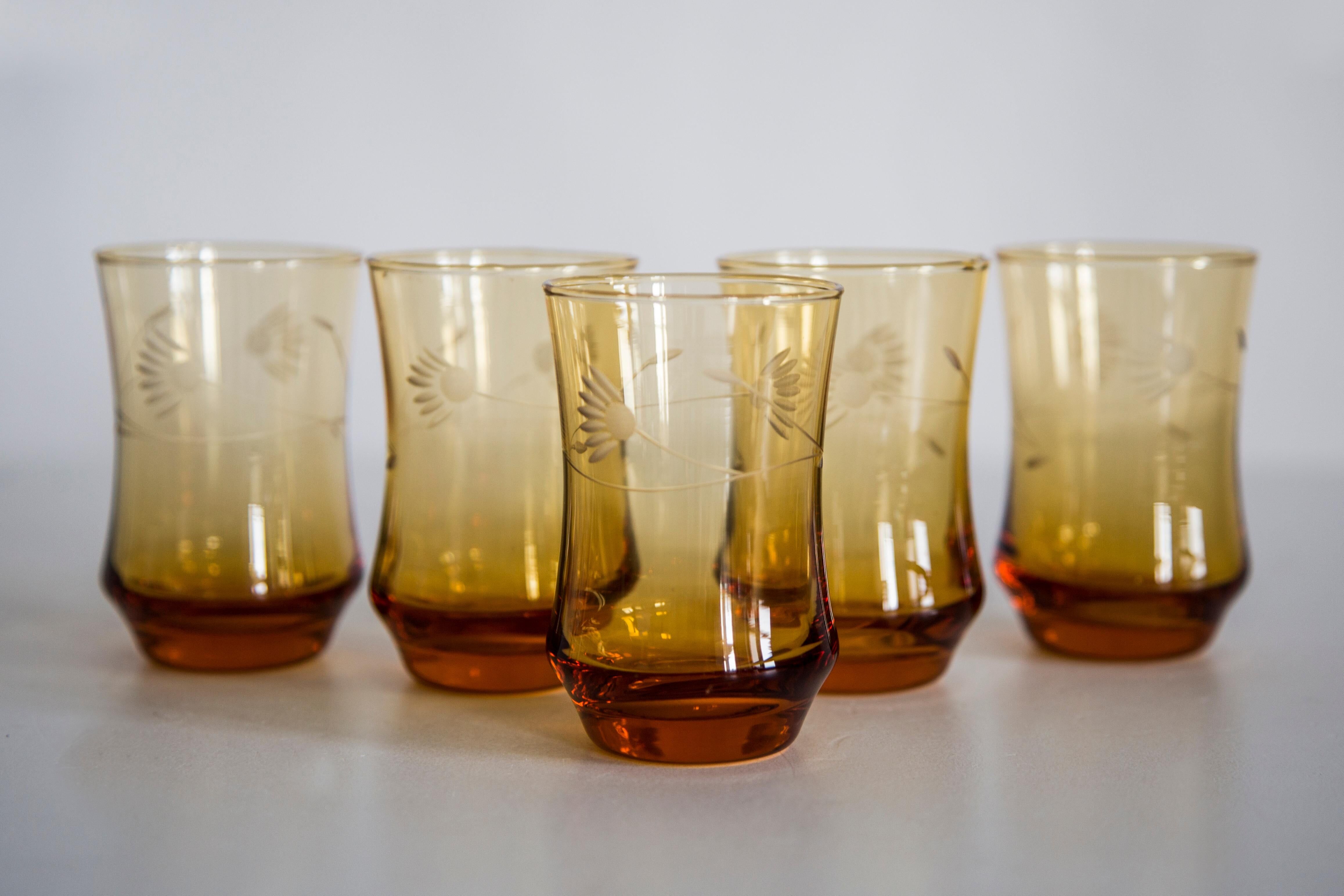 Set of six mid-century glasses and yellow Murano pot, Europe, 1960s.