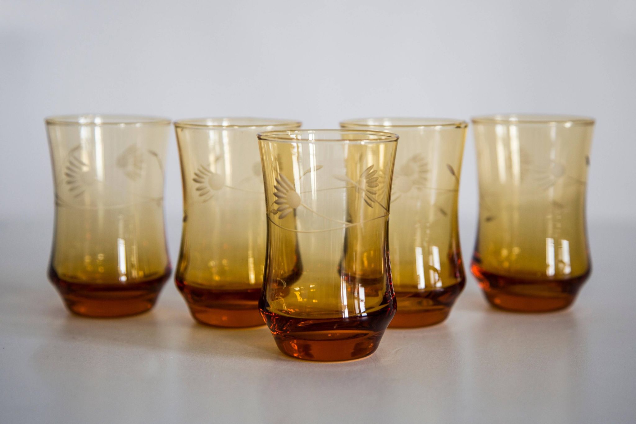 Set of six mid-century glasses and yellow Murano pot, Europe, 1960s.