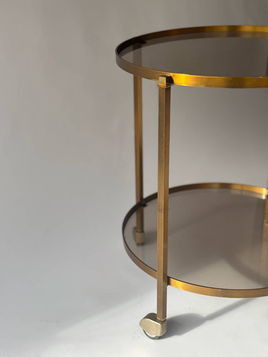 Rolling dessert trolley in brass and smoked glass, 1960