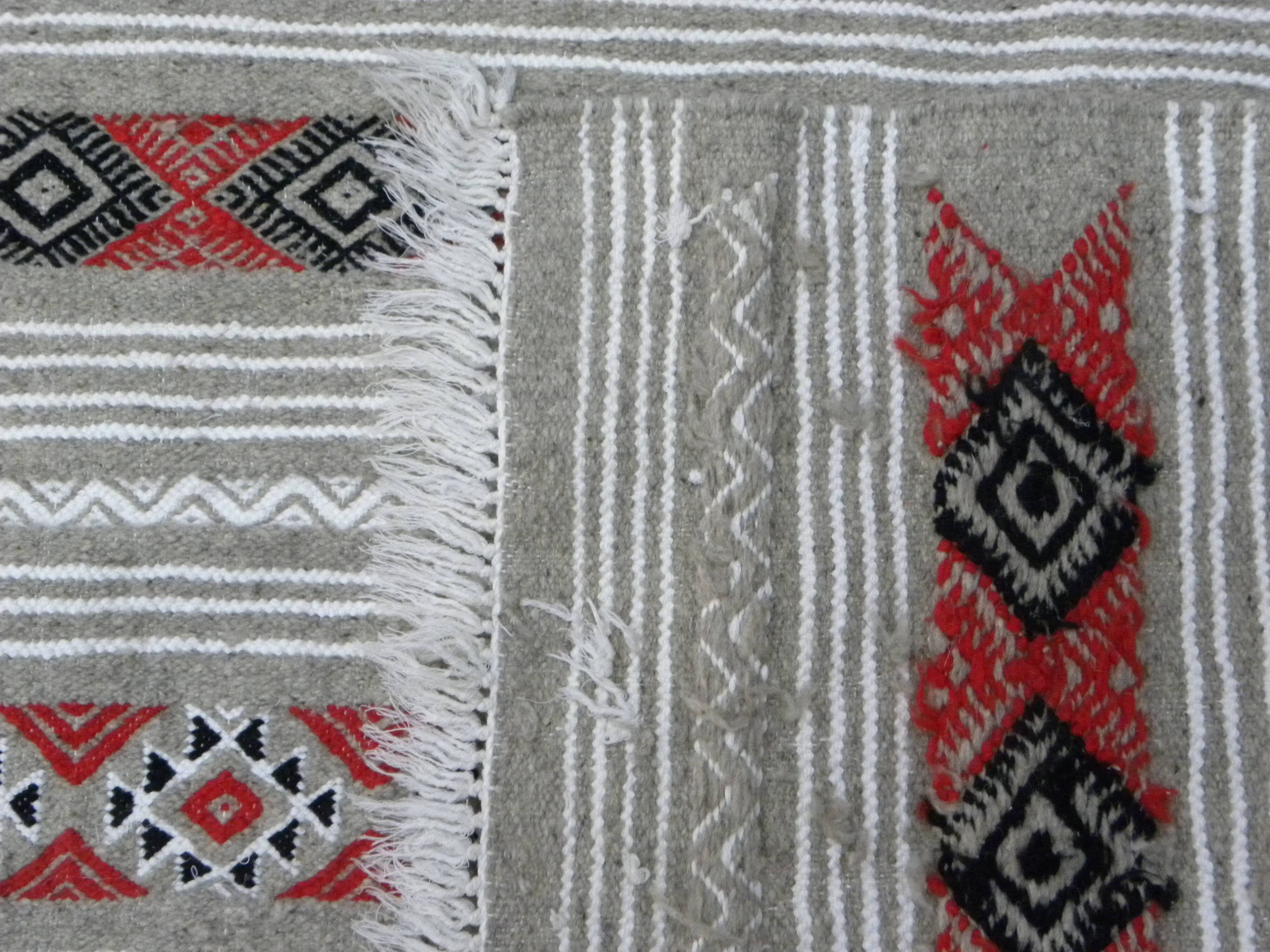Geometric woven rug with fringes – Ethnic style – Hallway & interior